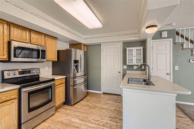 4081 Odessa St, Denver, CO 80249 - kitchen featuring stainless steel appliances, a sink, baseboards, light countertops, and light wood-style floors