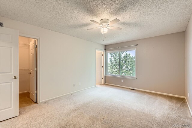 4081 Odessa St, Denver, CO 80249 - spare room with carpet flooring, a ceiling fan, baseboards, and a textured ceiling