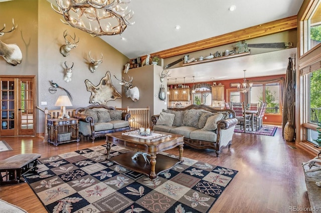 living room with hardwood / wood-style flooring, beam ceiling, high vaulted ceiling, and french doors