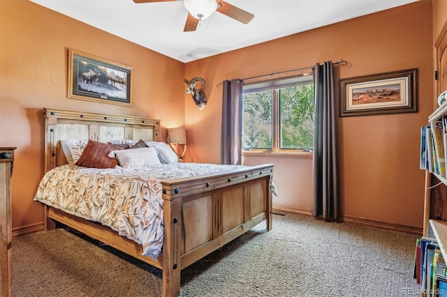 bedroom featuring ceiling fan and carpet