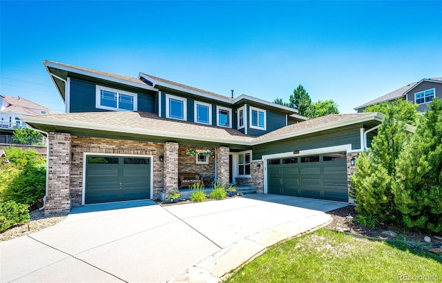 24036 E Kettle Pl, Aurora, CO 80016 - view of front of house featuring concrete driveway, an attached garage, and brick siding