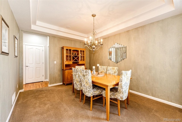 24036 E Kettle Pl, Aurora, CO 80016 - carpeted dining room with a raised ceiling and a chandelier