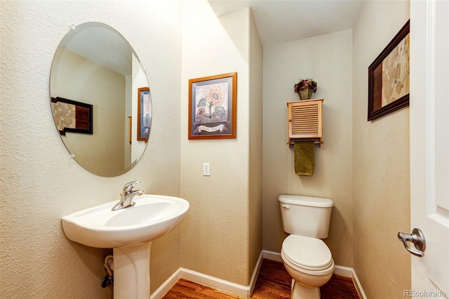24036 E Kettle Pl, Aurora, CO 80016 - bathroom featuring wood finished floors and toilet