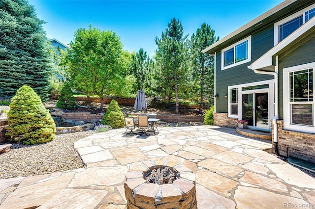 24036 E Kettle Pl, Aurora, CO 80016 - view of patio with outdoor dining area and a fire pit