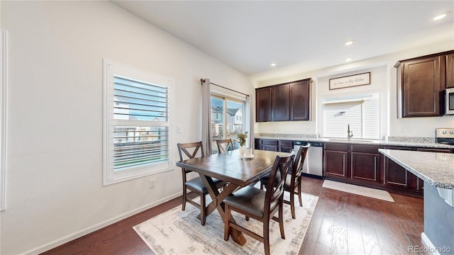 dining area with baseboards, dark wood-style flooring, and recessed lighting