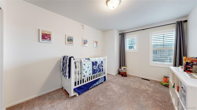 carpeted bedroom with baseboards