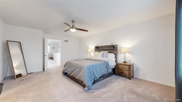 bedroom with light carpet, ceiling fan, visible vents, and baseboards