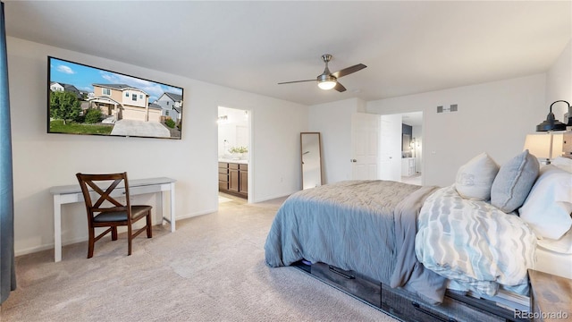 bedroom with light carpet, ensuite bath, visible vents, and baseboards