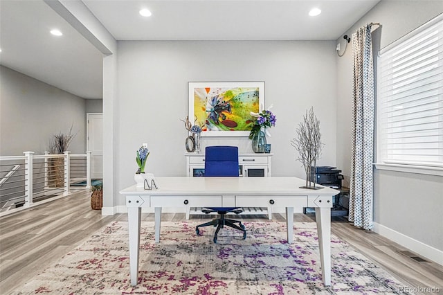 office space with baseboards, wood finished floors, visible vents, and recessed lighting