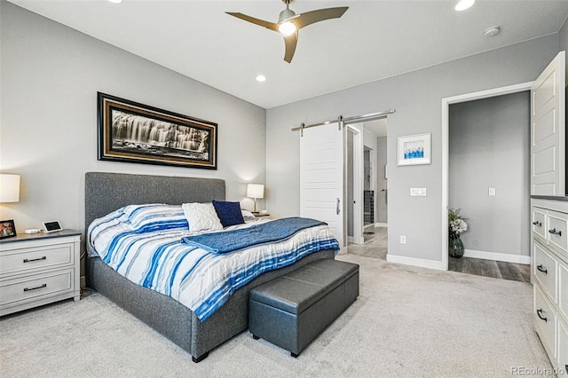 bedroom with light carpet, a barn door, baseboards, recessed lighting, and ceiling fan