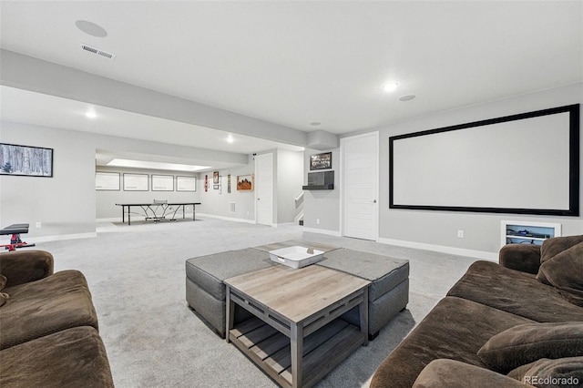 carpeted cinema room featuring baseboards, visible vents, and recessed lighting