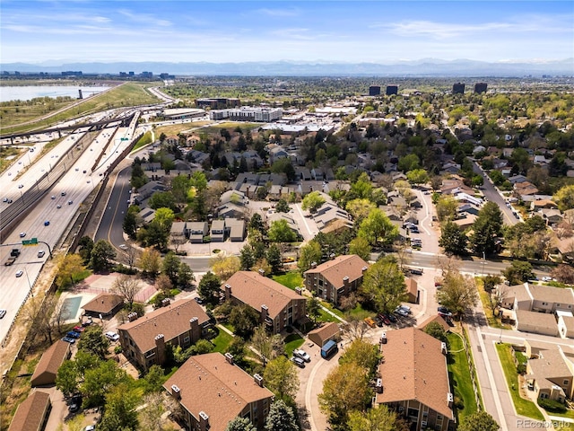 aerial overview of property's location with a highway, a large body of water, and nearby suburban area