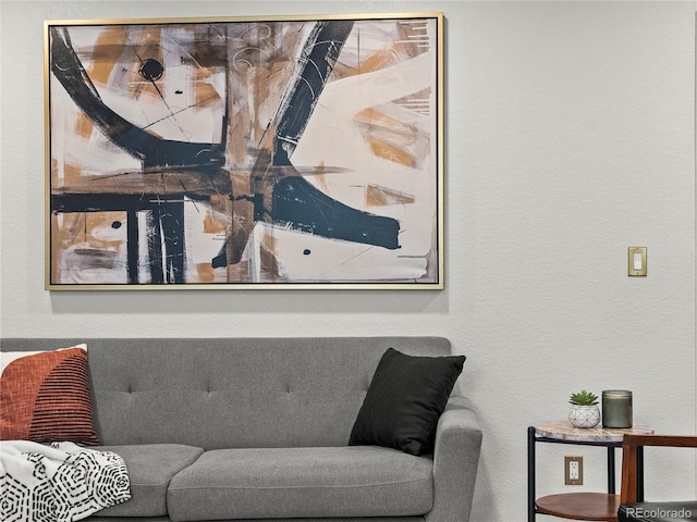 living area featuring a textured wall