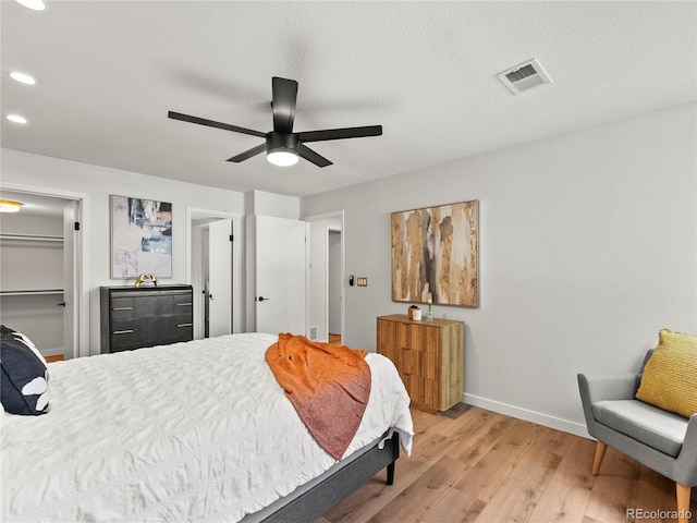 bedroom featuring baseboards, light wood-style floors, recessed lighting, and ceiling fan