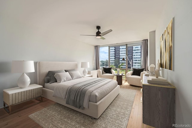 3100 E Cherry Creek S Drive 404, Denver, CO 80209 - bedroom with light wood-style flooring, floor to ceiling windows, and a ceiling fan