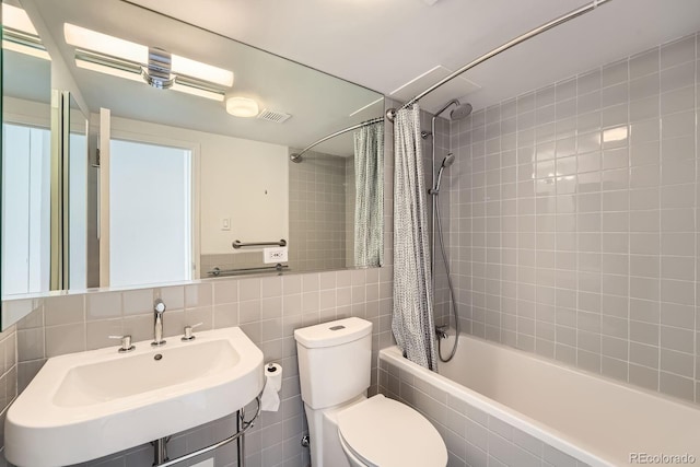 3100 E Cherry Creek S Drive 404, Denver, CO 80209 - full bath featuring tiled shower / bath, a sink, toilet, and tile walls