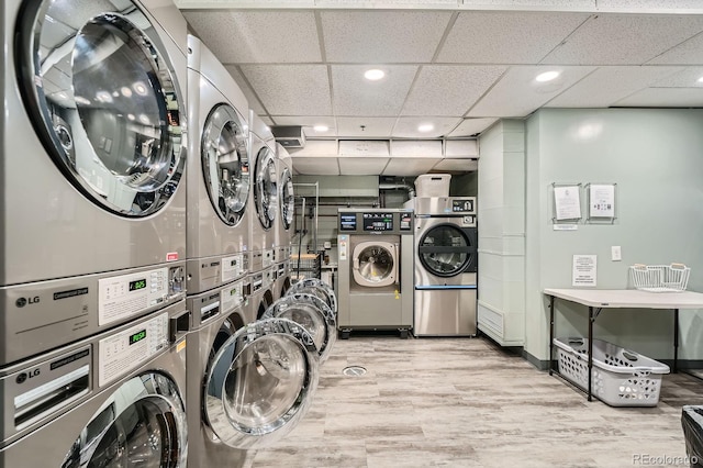 3100 E Cherry Creek S Drive 404, Denver, CO 80209 - community laundry room with stacked washer / dryer, recessed lighting, and wood finished floors