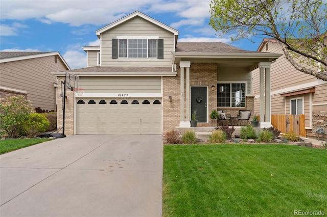 10475 E Abilene St, Commerce City, CO 80022 - tri-level home with a front lawn, driveway, brick siding, an attached garage, and a shingled roof