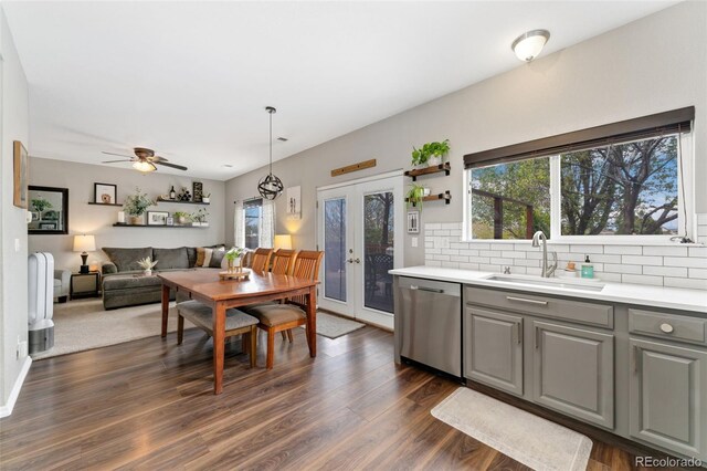 10475 E Abilene St, Commerce City, CO 80022 - kitchen with a sink, stainless steel dishwasher, gray cabinetry, french doors, and decorative backsplash