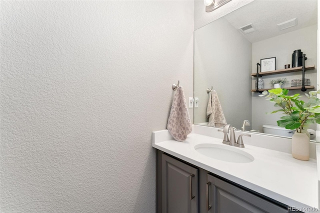 10475 E Abilene St, Commerce City, CO 80022 - half bathroom featuring vanity and toilet