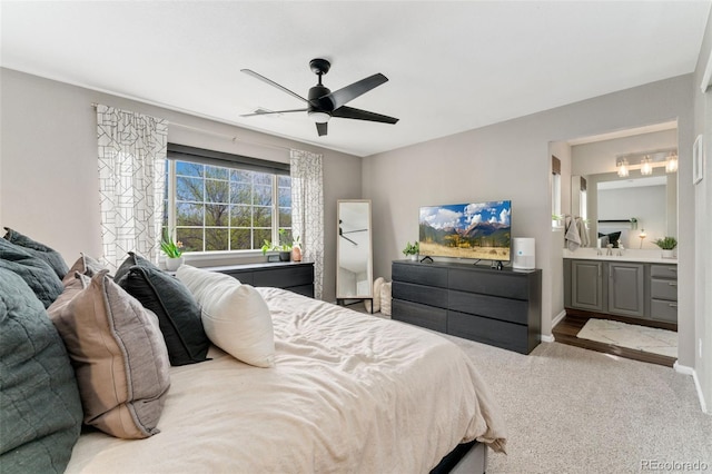 10475 E Abilene St, Commerce City, CO 80022 - bedroom with carpet flooring, baseboards, ceiling fan, and ensuite bath