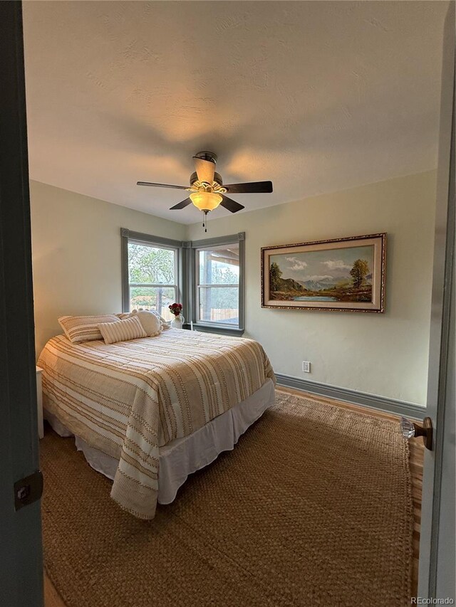 520 W San Miguel St, Colorado Springs, CO 80905 - bedroom with ceiling fan and baseboards
