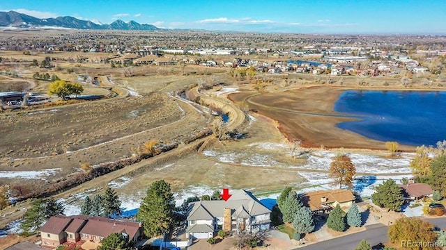 aerial view featuring a water and mountain view