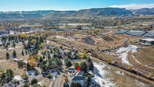 birds eye view of property with a mountain view