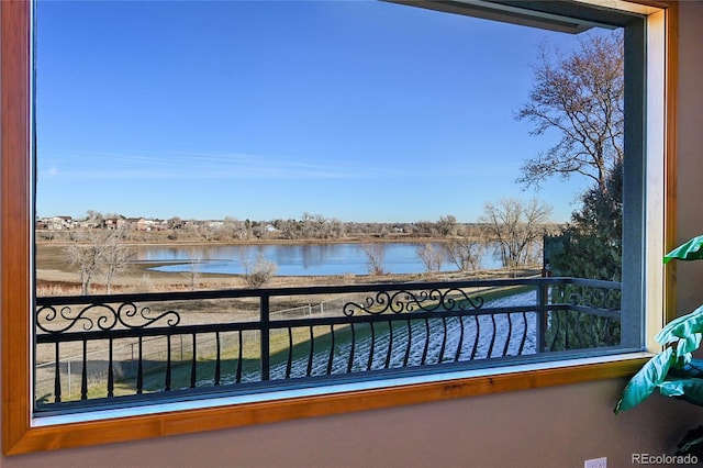 balcony featuring a water view