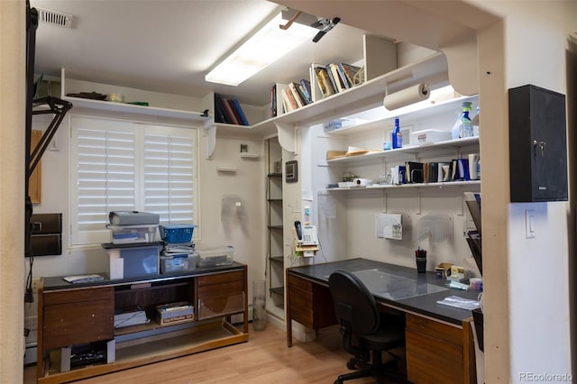 office with light hardwood / wood-style flooring