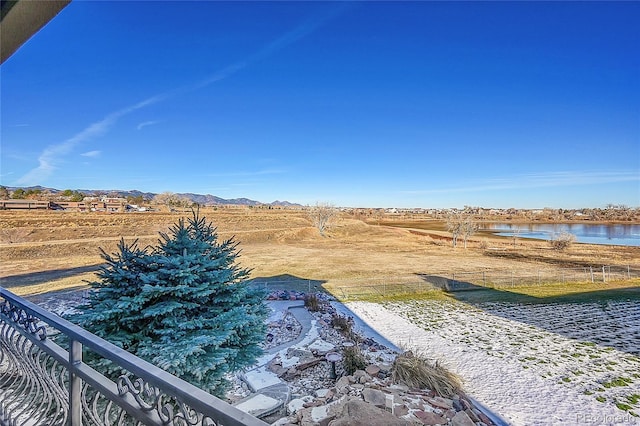 view of yard with a water and mountain view