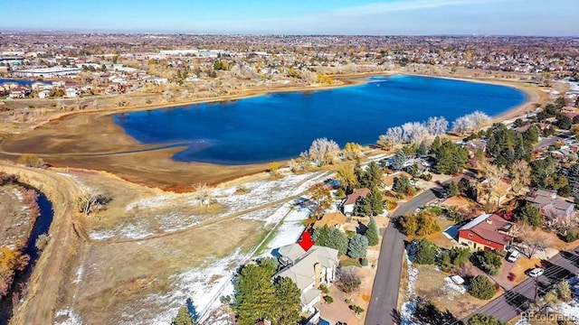 birds eye view of property with a water view