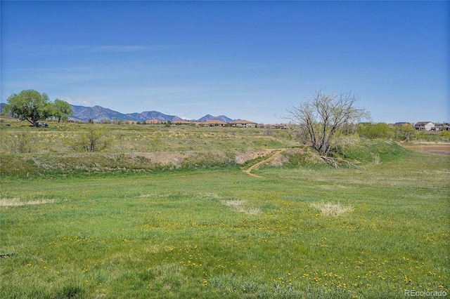 view of mountain background featuring rural landscape