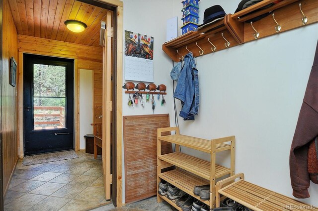 1111 Red Feather Rd, Cotopaxi, CO 81223 - mudroom with stone finish floors, wood walls, and wood ceiling