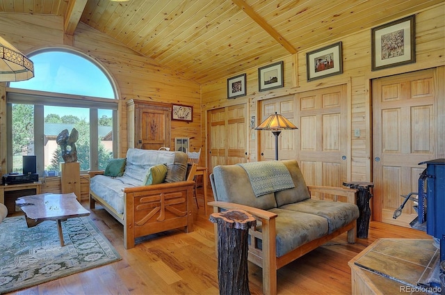 1111 Red Feather Rd, Cotopaxi, CO 81223 - living room with wooden walls, high vaulted ceiling, wooden ceiling with exposed beams, and light wood-style floors