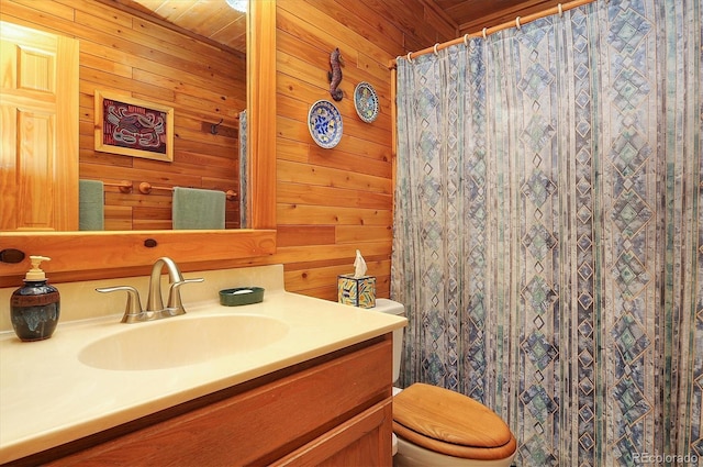 1111 Red Feather Rd, Cotopaxi, CO 81223 - full bathroom featuring toilet, wooden walls, vanity, and a shower with curtain