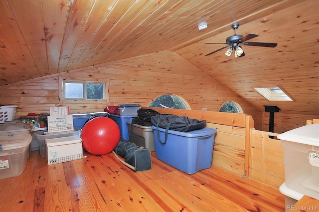 1111 Red Feather Rd, Cotopaxi, CO 81223 - additional living space featuring wood ceiling, wooden walls, vaulted ceiling, hardwood / wood-style flooring, and ceiling fan