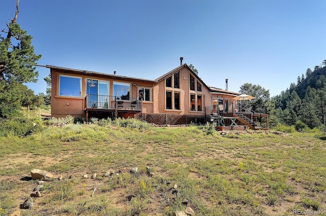 1111 Red Feather Rd, Cotopaxi, CO 81223 - rear view of house with a deck, stairs, and stucco siding