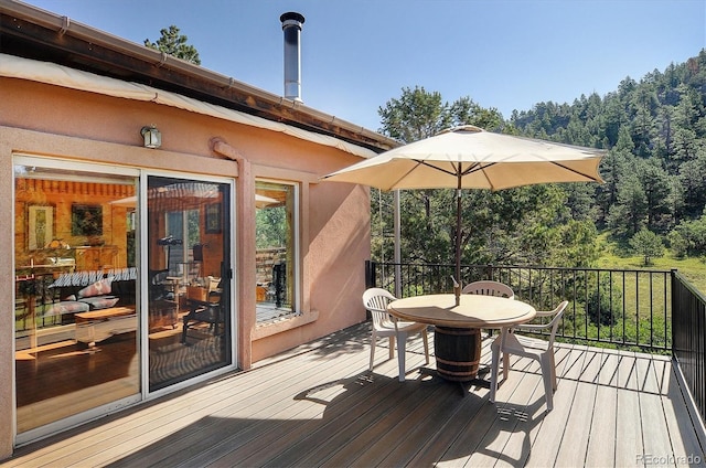 1111 Red Feather Rd, Cotopaxi, CO 81223 - wooden terrace with outdoor dining space