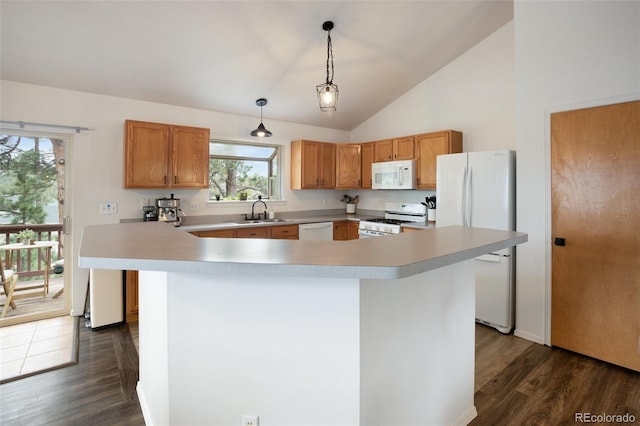 121 Aspen Dr, Woodland Park, CO 80863 - kitchen featuring white appliances, a sink, light countertops, dark wood-style floors, and decorative light fixtures