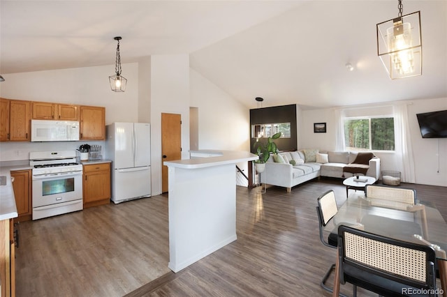 121 Aspen Dr, Woodland Park, CO 80863 - kitchen featuring white appliances, light countertops, open floor plan, decorative light fixtures, and high vaulted ceiling