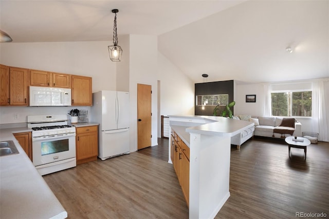 121 Aspen Dr, Woodland Park, CO 80863 - kitchen with white appliances, high vaulted ceiling, open floor plan, light countertops, and decorative light fixtures