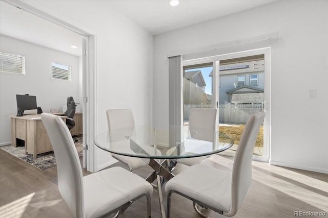 dining space with recessed lighting, baseboards, and light wood-style floors