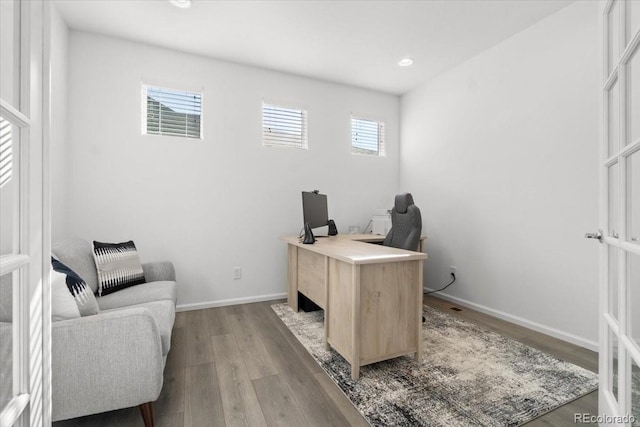 home office with recessed lighting, baseboards, and wood finished floors