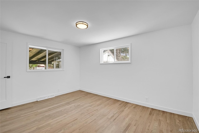 unfurnished room featuring light hardwood / wood-style floors