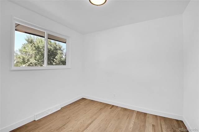 empty room with light wood-type flooring