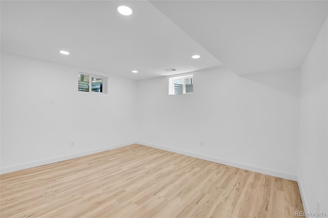 basement featuring light wood-type flooring