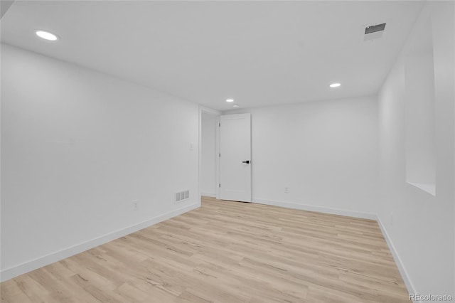 spare room featuring light wood-type flooring