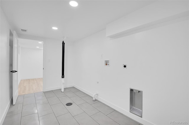 washroom featuring washer hookup, electric dryer hookup, light tile patterned flooring, and hookup for a gas dryer