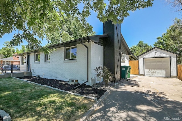 view of side of property with an outbuilding and a garage